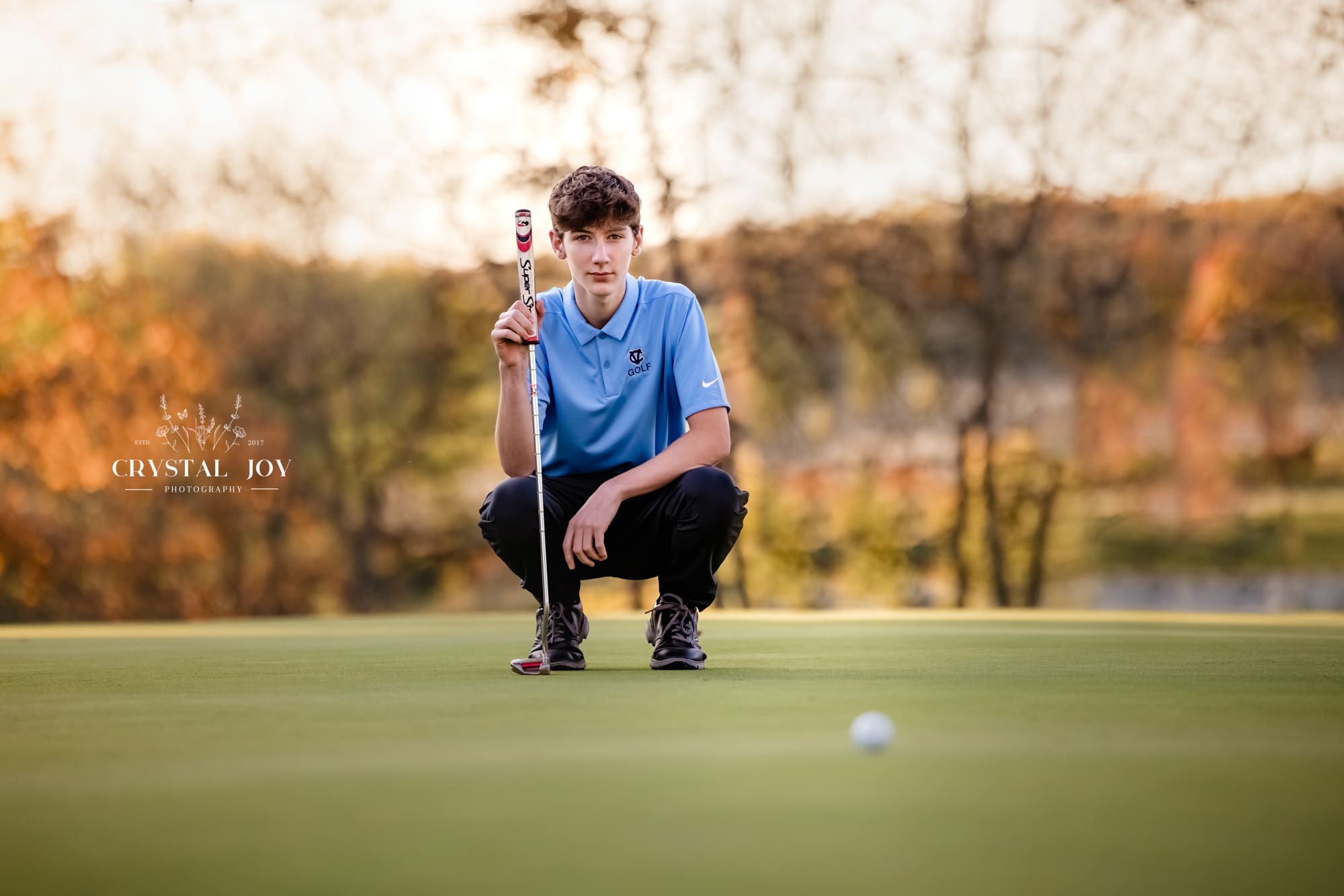 Boy golfing senior photo